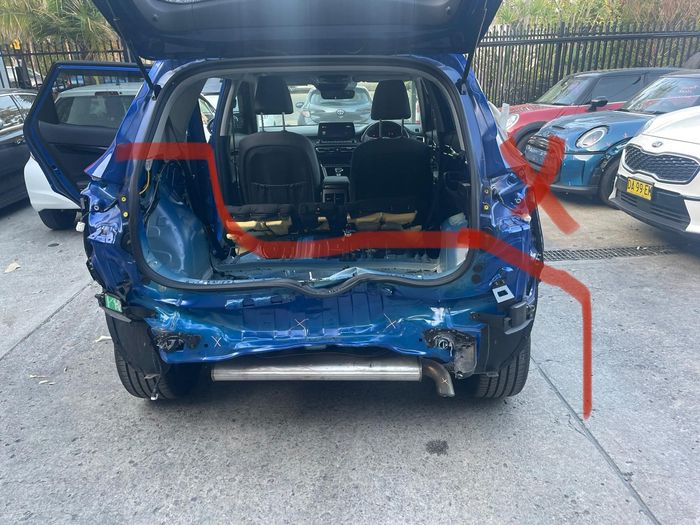 Kia Seltos with severe rear-end collision damage