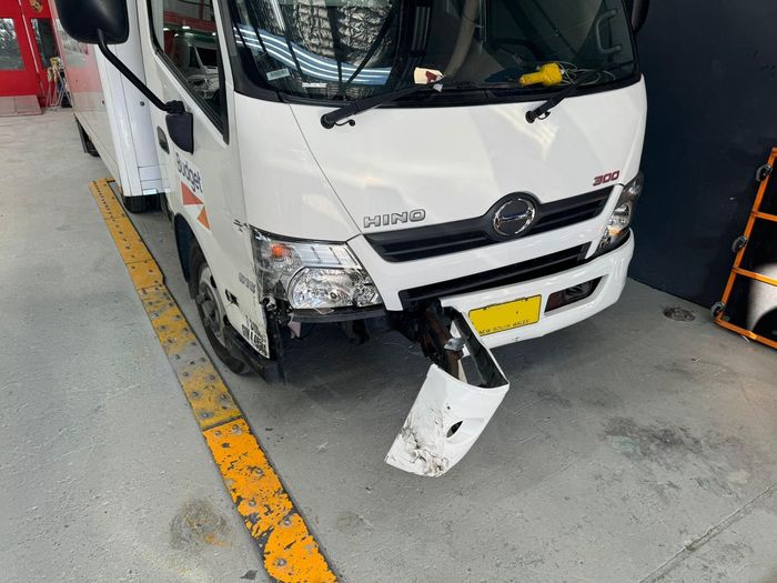 Hino truck with damaged front bumper
