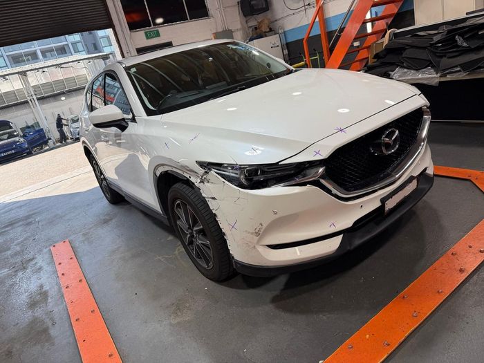 Mazda CX-5 with dented and scraped front