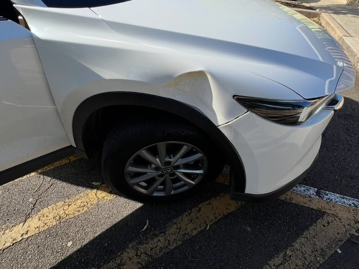 Mazda CX-5 with damaged front guard and bonnet