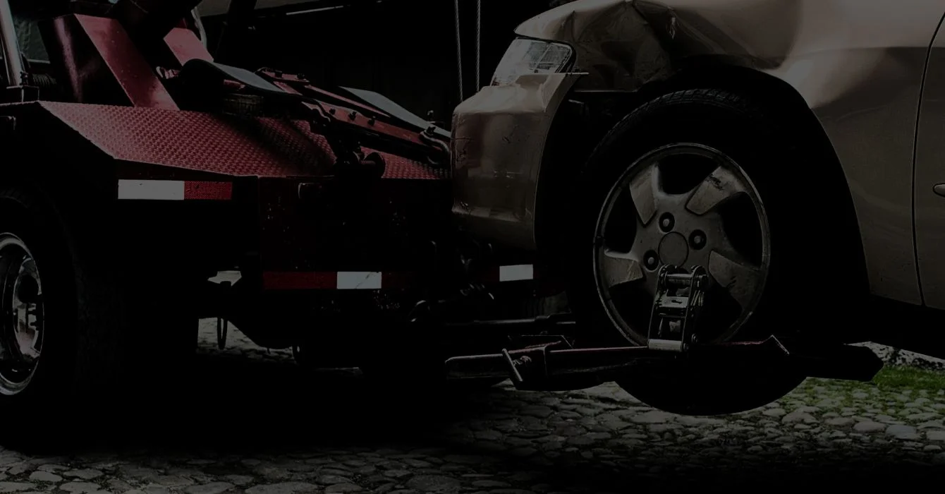 A vehicle being towed promptly, representing fast support and immediate response in smash repair services.