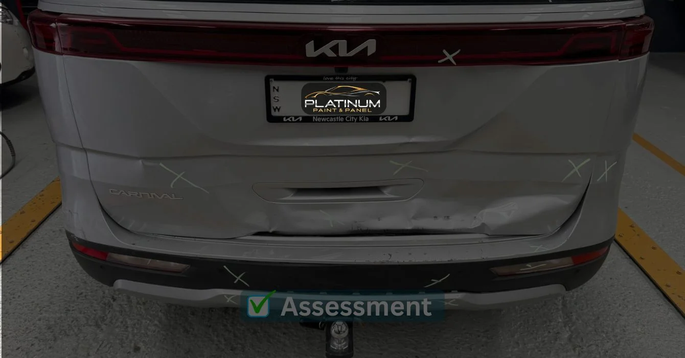 A damaged vehicle marked with multiple X signs indicating repair areas, representing a thorough damage assessment process.